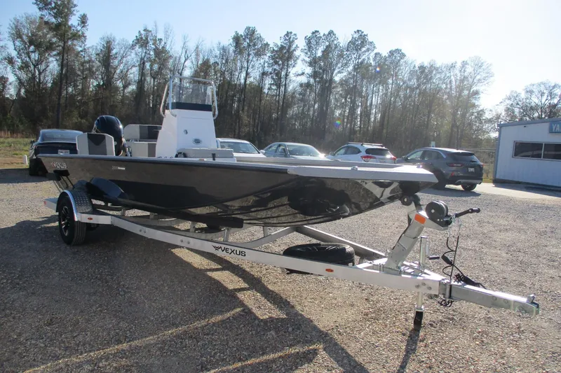 Slide: The Image of 2026 Vexus Defender 201 boat on trailer in outdoor setting. - 9