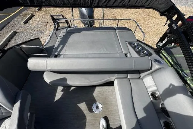 Slide: The Image of 2022 Bennington 23 LSB boat interior with gray seating and cup holders. - 5