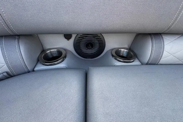 Slide: The Image of 2022 Bennington 23 LSB boat interior with cup holders and speaker. - 7