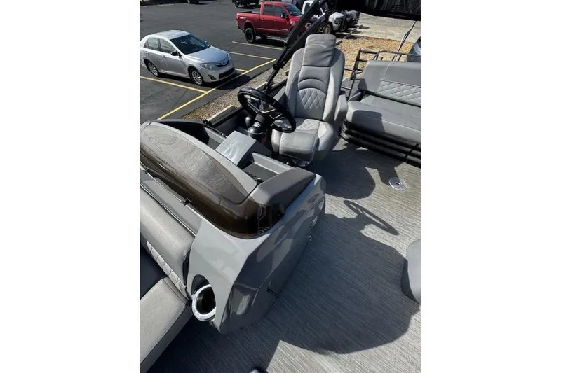 Slide: The Image of 2022 Bennington 23 LSB boat interior with steering wheel and seating area. - 8