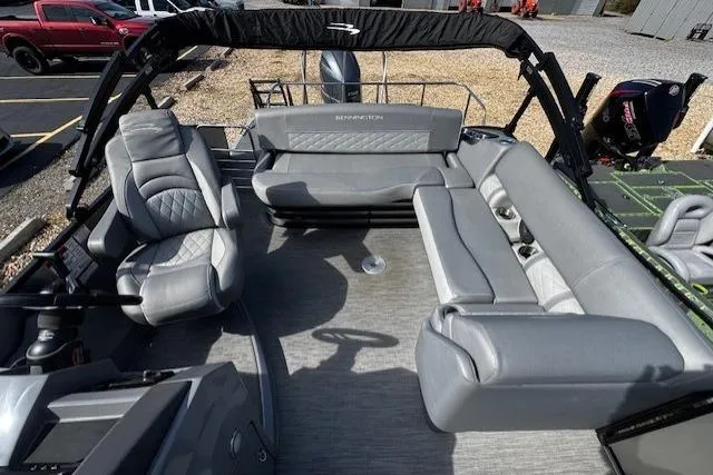Slide: The Image of 2022 Bennington 23 LSB pontoon boat interior with gray seating and modern design. - 11