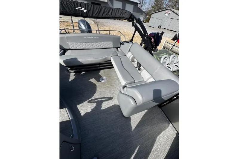 Slide: The Image of 2022 Bennington 23 LSB pontoon boat with gray seating and modern design. - 4