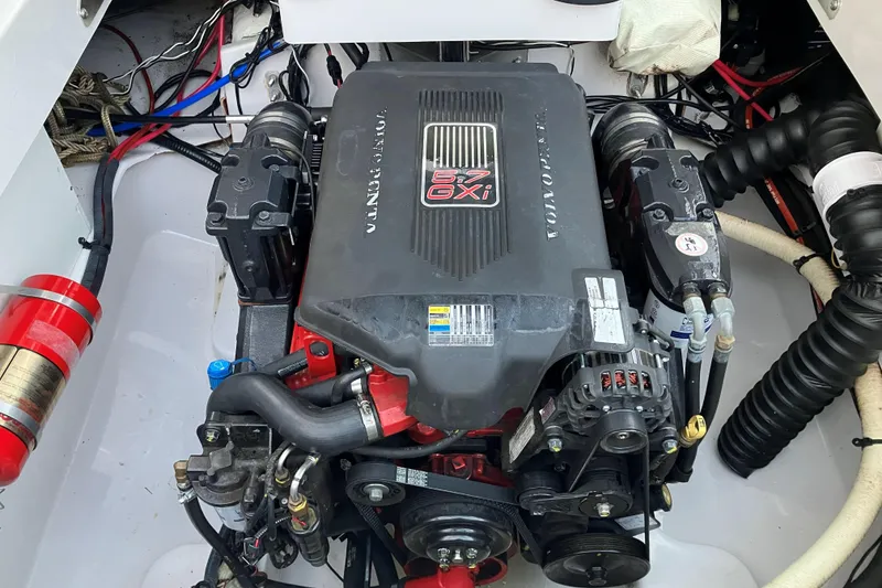 Slide: The Image of Engine compartment of a 2006 Four Winns 240 Horizon boat, featuring a Volvo Penta 5.7 GXI engine. - 10