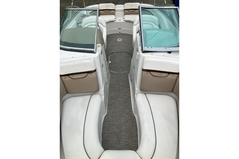 Slide: The Image of 2006 Four Winns 240 Horizon boat interior with white seating and open bow layout. - 11