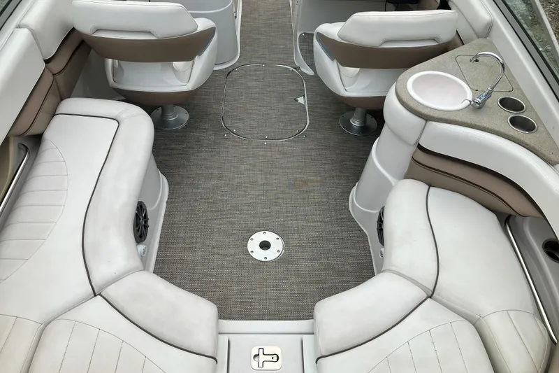 Slide: The Image of 2006 Four Winns 240 Horizon boat interior with seating and sink. - 16