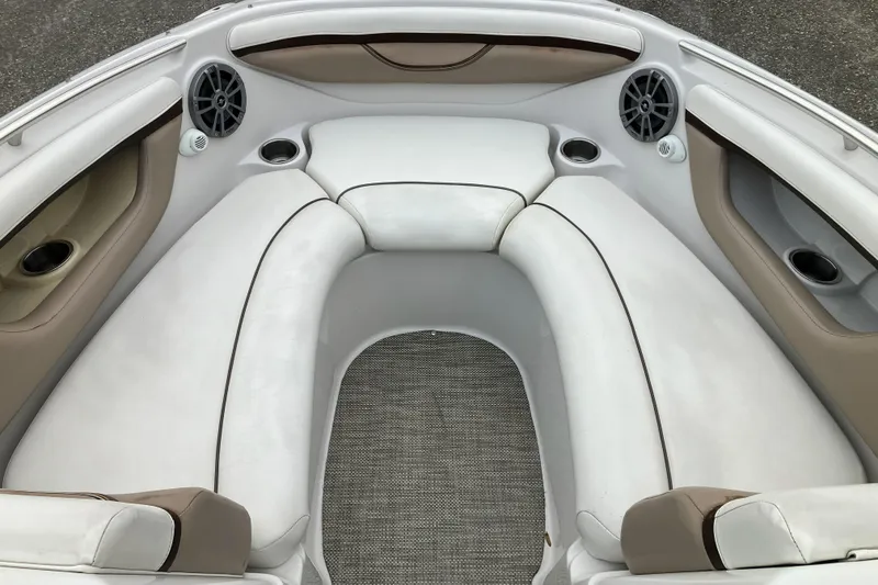 Slide: The Image of Interior of 2006 Four Winns 240 Horizon boat with white seating and speakers. - 8
