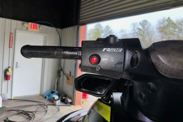 Slide: The Image of Handlebar controls of a 2019 Yamaha WaveRunner VX Deluxe in a garage setting. - 10