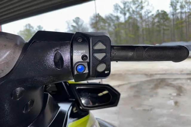 Slide: The Image of 2019 Yamaha WaveRunner VX Deluxe handlebar with no-wake mode button, outdoors. - 11