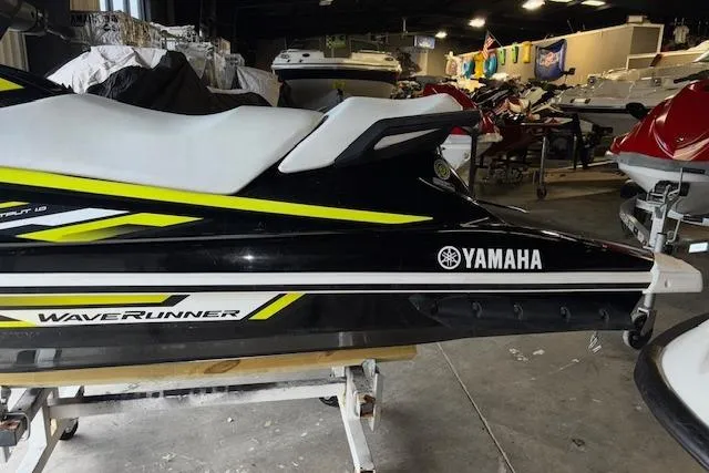 Slide: The Image of 2019 Yamaha WaveRunner VX Deluxe in showroom, black with yellow accents. - 3