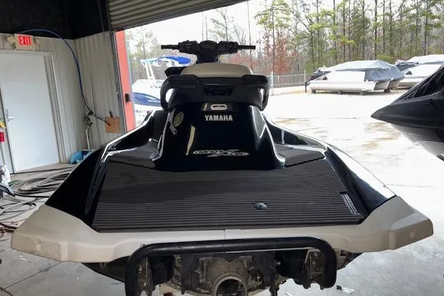 Slide: The Image of 2019 Yamaha WaveRunner VX Deluxe in storage, rear view, black and white design. - 4