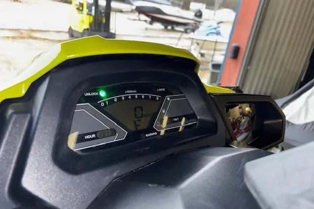 Slide: The Image of 2019 Yamaha WaveRunner VX Deluxe dashboard with digital display in a garage setting. - 9