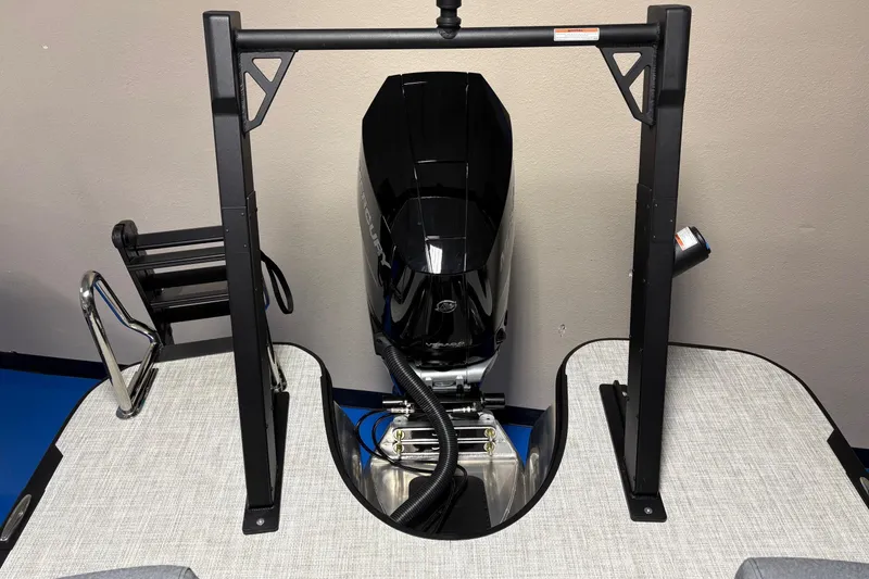 Slide: The Image of Alera M25Q 2026 boat motor mounted on a sturdy frame, indoors. - 14