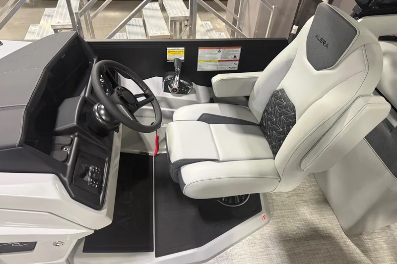 Slide: The Image of 2026 Alera M25Q pontoon boat displayed indoors at a boat show. - 3