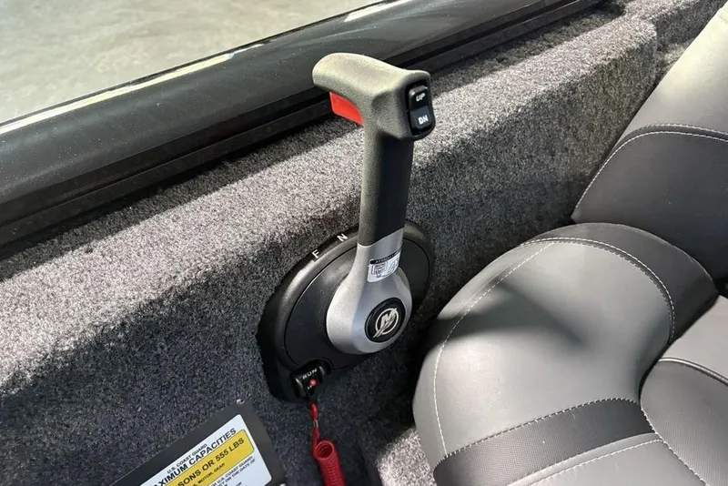 Slide: The Image of 2026 Tracker Pro Team 175 boat throttle control and seating detail. - 15