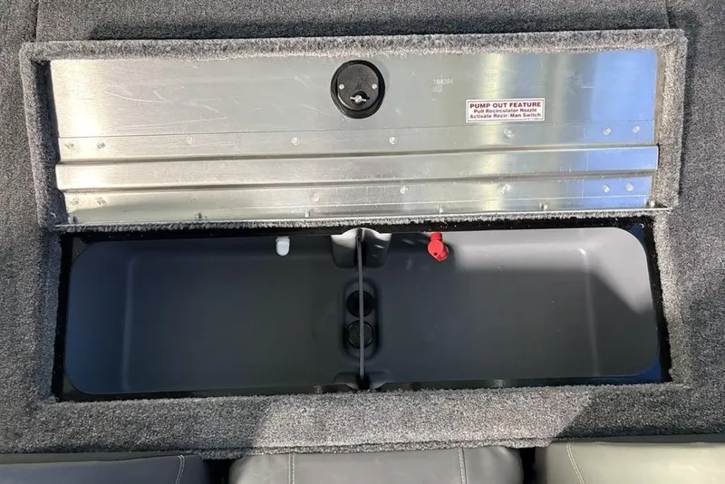Slide: The Image of 2026 Tracker Pro Team 175 boat storage compartment with pump-out feature. - 24