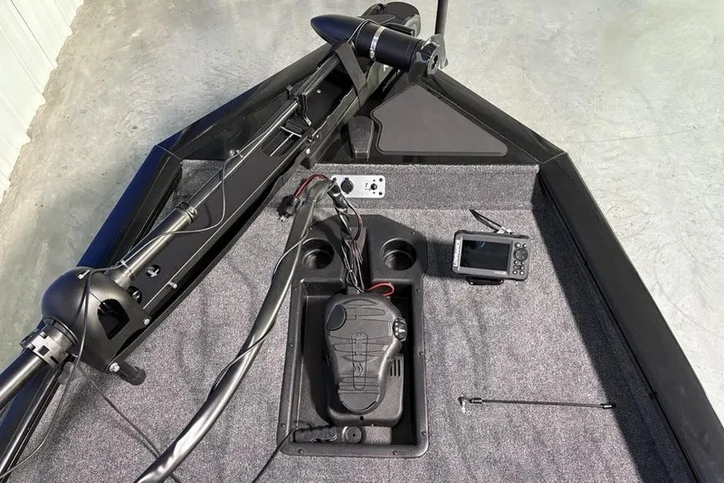 Slide: The Image of 2026 Tracker Pro Team 175 boat deck with control panel and fish finder. - 4