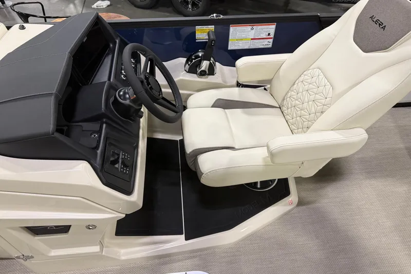 Slide: The Image of Captain's seat and helm of 2026 Alera M23L boat, featuring modern controls and luxurious design. - 10