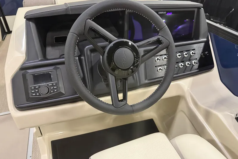 Slide: The Image of Steering console of 2026 Alera M23L boat with modern controls and display. - 11