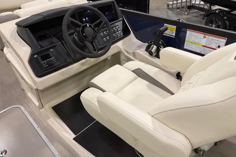 Slide: The Image of Interior of 2026 Alera M23L boat with steering wheel and control panel. - 5