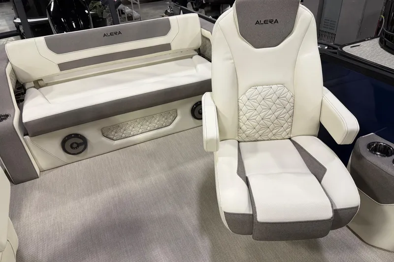 Slide: The Image of 2026 Alera M23L boat interior with luxurious white and gray seating. - 9