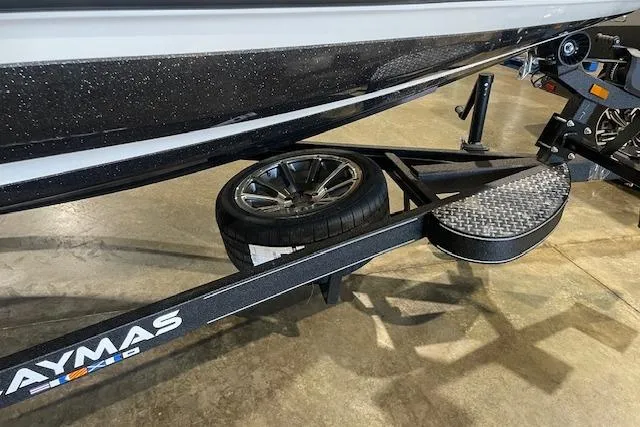 Slide: The Image of 2026 Caymas CX 20 boat trailer with spare tire and step platform. - 5