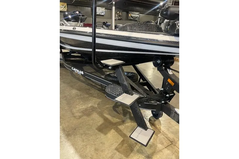 Slide: The Image of 2026 Caymas CX 20 boat on trailer, indoor showroom display. - 6
