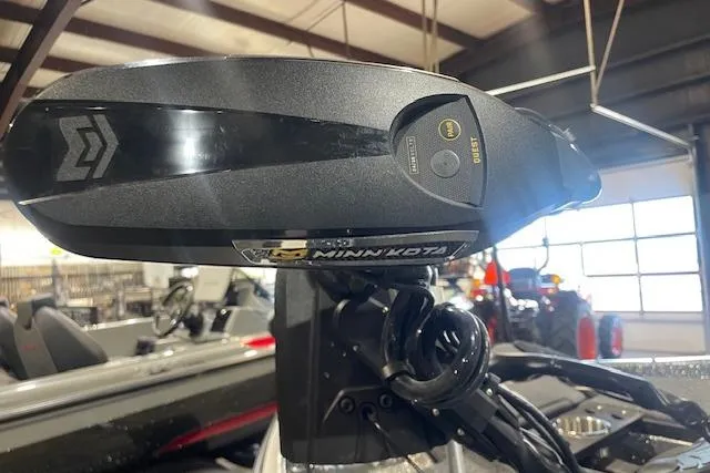 Slide: The Image of 2026 Caymas CX 20 boat with Minn Kota trolling motor in a showroom. - 7