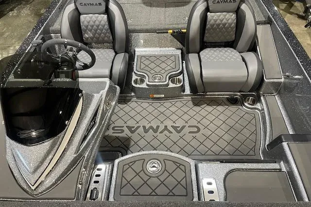 Slide: The Image of 2026 Caymas CX 20 boat interior with sleek seating and modern dashboard design. - 9