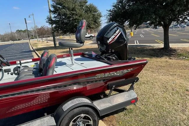Slide: The Image of 2020 Ranger RT178 boat with Mercury engine, parked outdoors on a sunny day. - 4