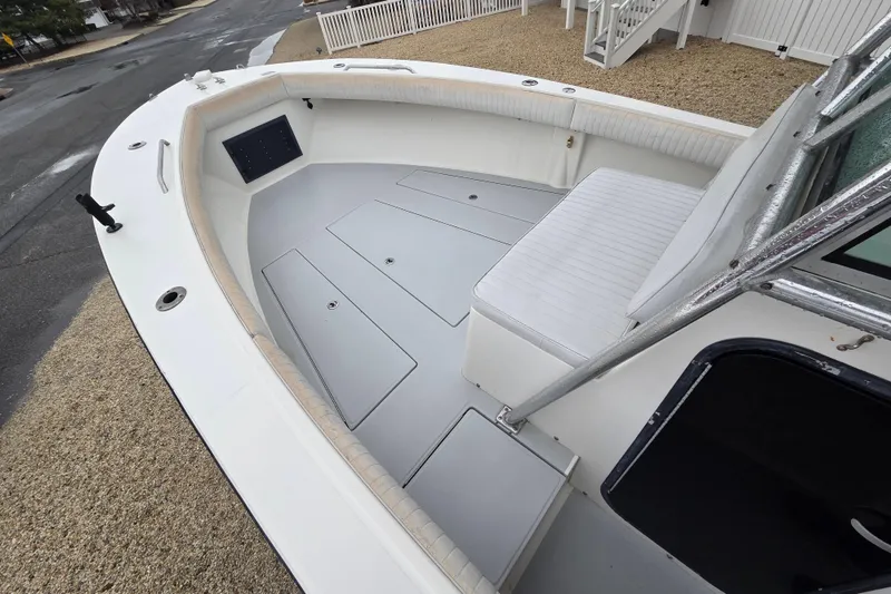 Slide: The Image of 1996 Regulator 26 Classic boat interior with seating and storage compartments. - 17
