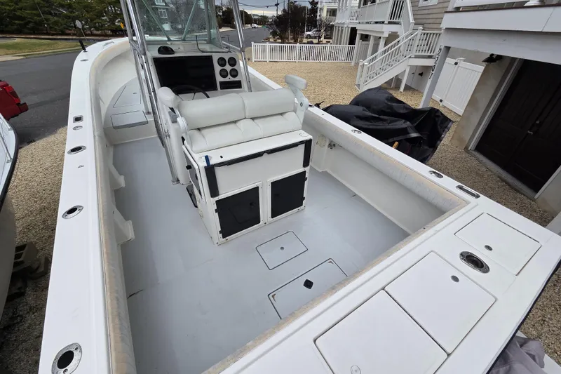 Slide: The Image of 1996 Regulator 26 Classic boat interior with seating and control panel. - 8
