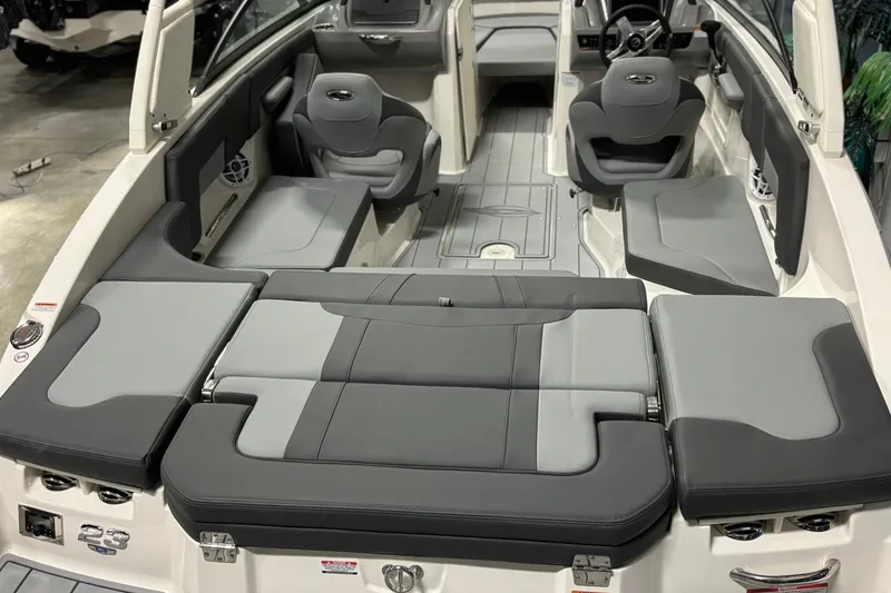 Slide: The Image of 2026 Chaparral 23 SSi boat interior with gray seating and modern design. - 14