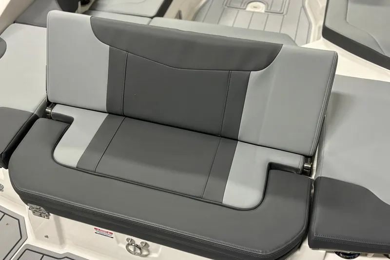 Slide: The Image of 2026 Chaparral 23 SSi boat seat, featuring sleek gray upholstery and modern design. - 16