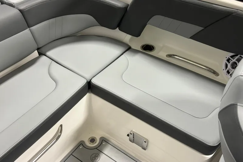 Slide: The Image of 2026 Chaparral 23 SSi boat interior with gray seating and stainless steel accents. - 19