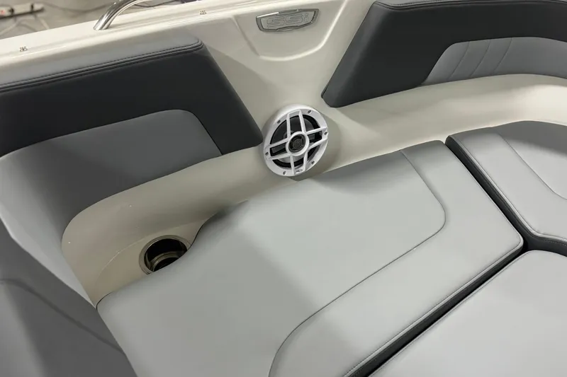 Slide: The Image of 2026 Chaparral 23 SSi boat interior with sleek seating and built-in speaker. - 28