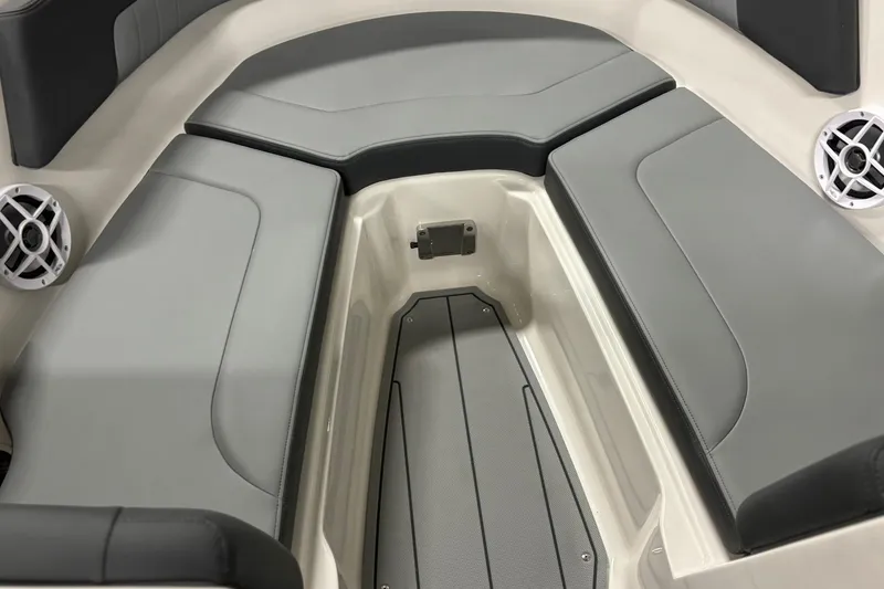 Slide: The Image of 2026 Chaparral 23 SSi boat interior with gray cushioned seating and speakers. - 30