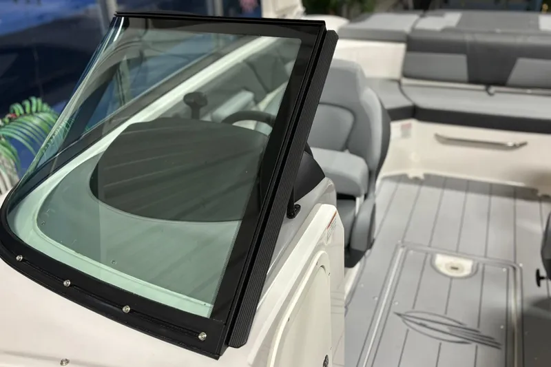 Slide: The Image of 2026 Chaparral 23 SSi boat interior with sleek seating and modern design. - 32