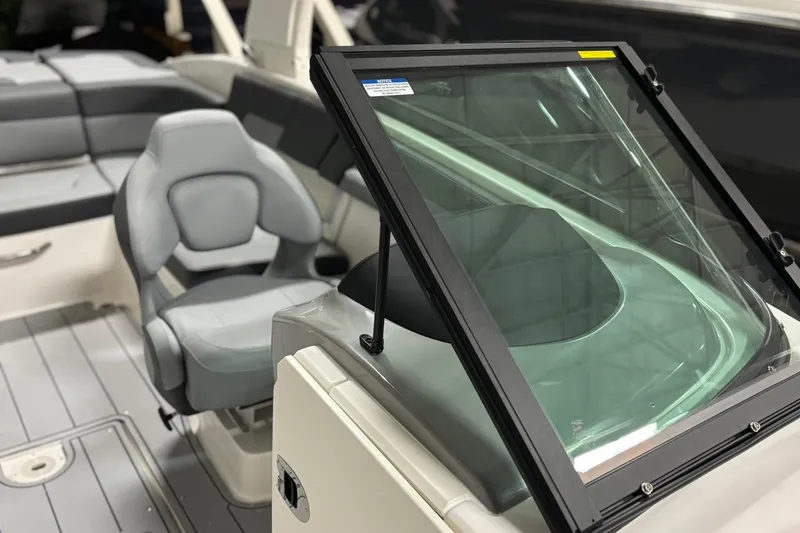 Slide: The Image of 2026 Chaparral 23 SSi boat interior with seating and windshield detail. - 33