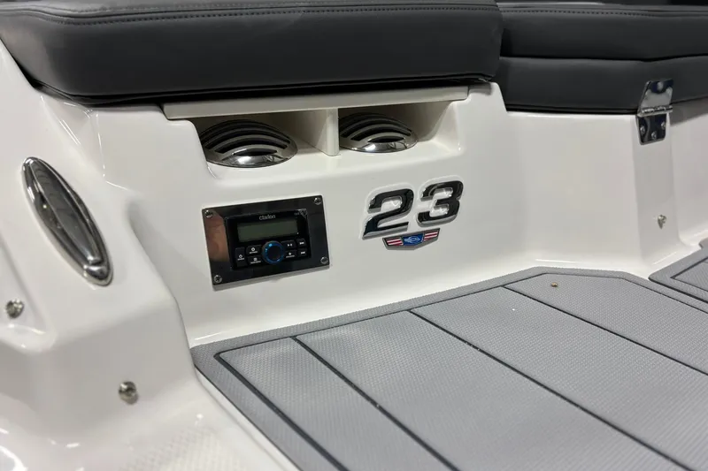 Slide: The Image of 2026 Chaparral 23 SSi boat interior with audio system and seating. - 7