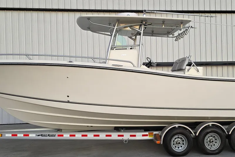 The Image of 2020 Mako 284 Center Console boat on trailer, side view. - 1