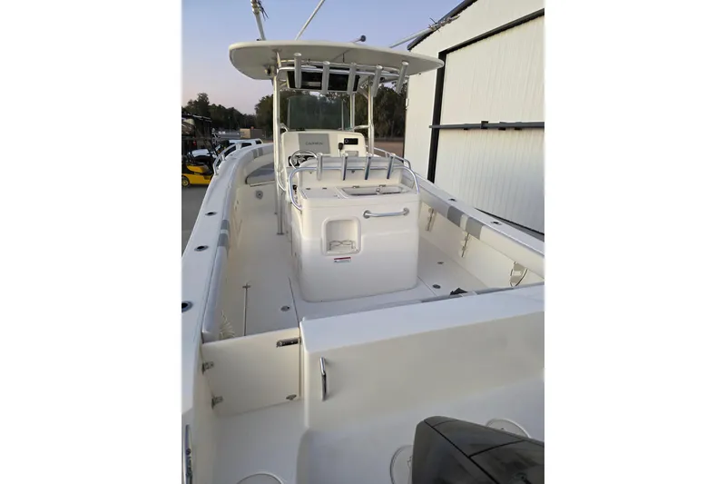 Slide: The Image of 2020 Mako 284 Center Console boat with spacious deck and modern helm. - 15