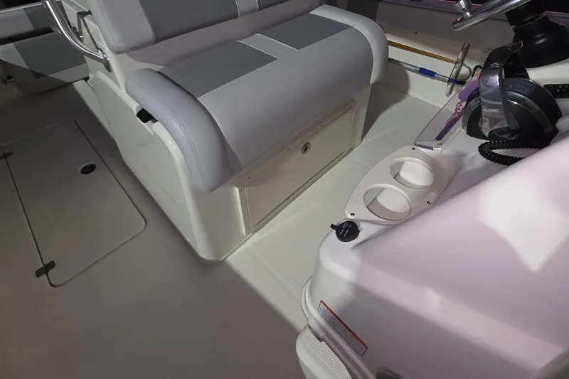Slide: The Image of 2020 Mako 284 Center Console interior with seating and console details. - 21