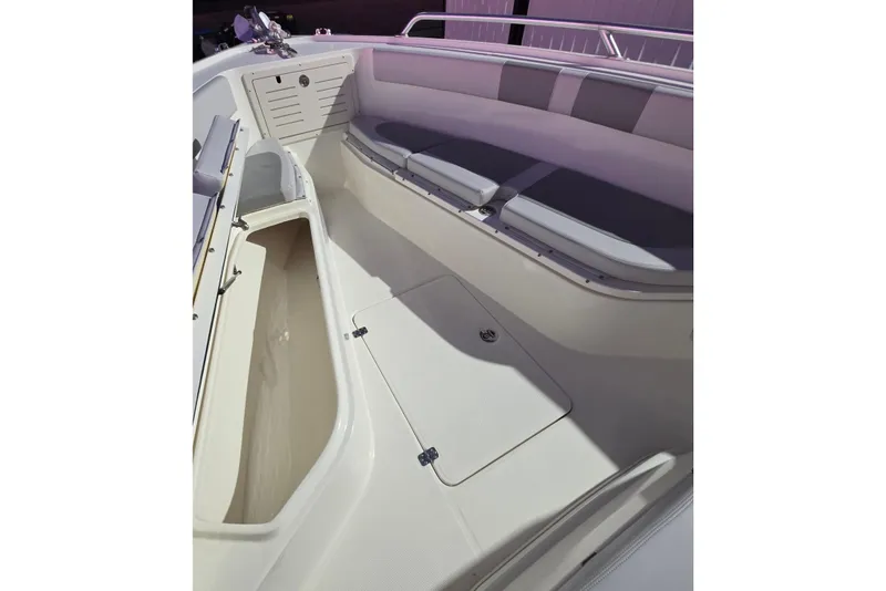 Slide: The Image of 2020 Mako 284 Center Console boat interior with seating and storage compartments. - 26
