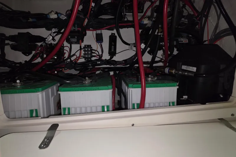 Slide: The Image of Battery compartment of a 2020 Mako 284 Center Console boat with wiring. - 32