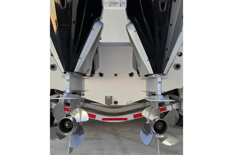 Slide: The Image of Rear view of 2020 Mako 284 Center Console boat with dual outboard engines. - 8