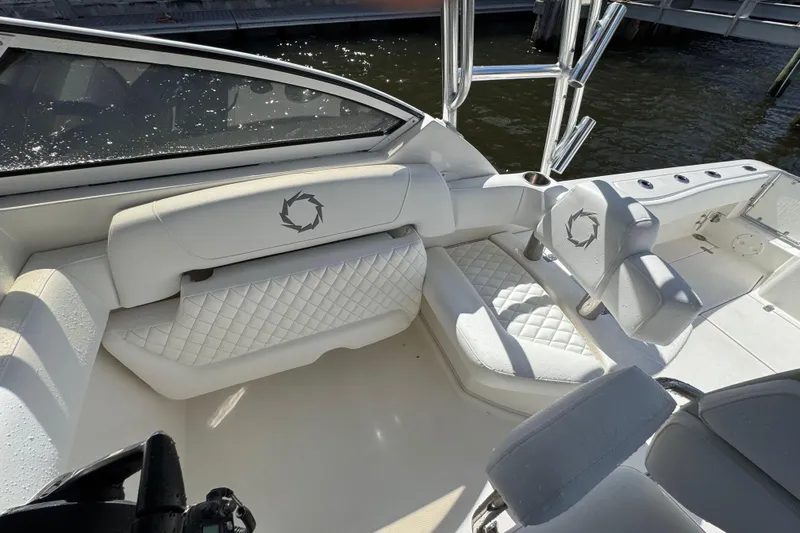 Slide: The Image of 2007 Fountain 33 Sportfish Cruiser interior with white quilted seating and sleek design. - 15