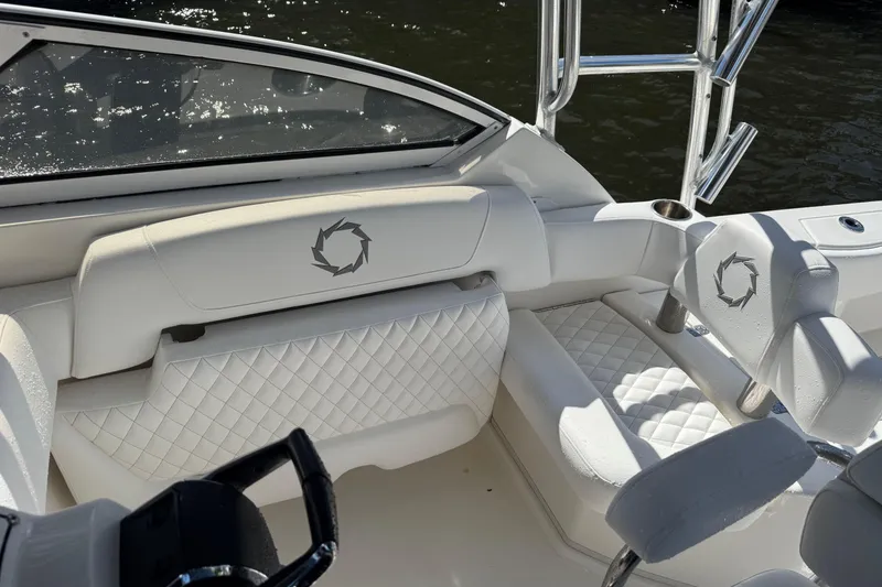 Slide: The Image of Luxurious interior of 2007 Fountain 33 Sportfish Cruiser with white quilted seating. - 17