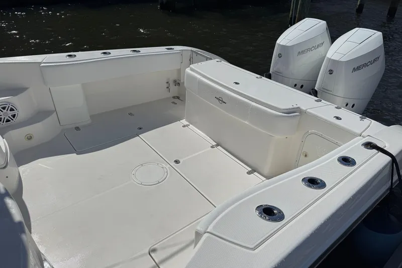 Slide: The Image of 2007 Fountain 33 Sportfish Cruiser boat deck with twin Mercury engines. - 18