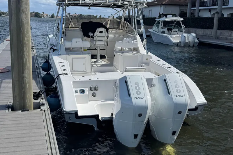 Slide: The Image of 2007 Fountain 33 Sportfish Cruiser with twin Mercury 400 V10 engines docked by the water. - 19