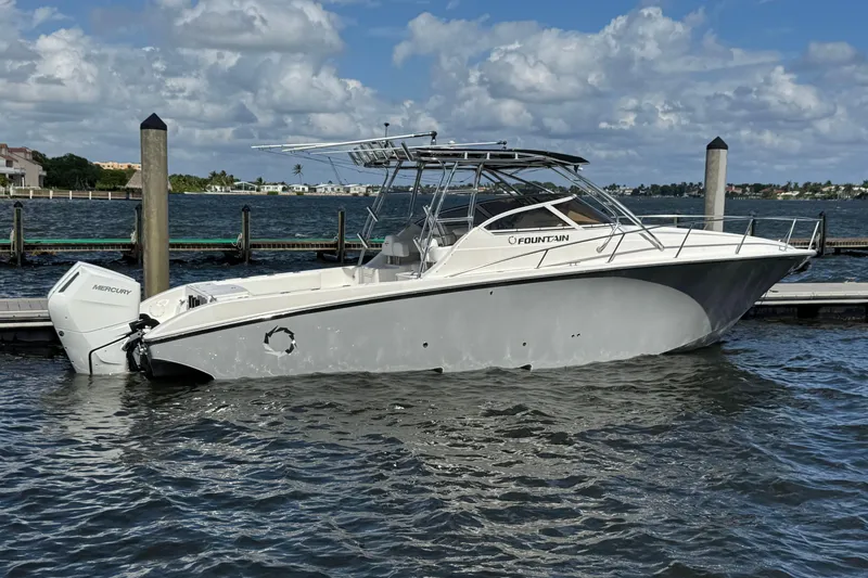 Slide: The Image of 2007 Fountain 33 Sportfish Cruiser docked on a sunny day. - 21